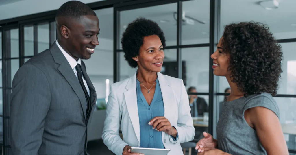 Professionals discussing plans in a modern office